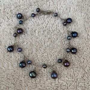 Sterling silver chain link bracelet featuring Tahitian or dark freshwater pearls